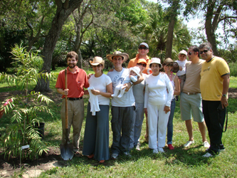 Paul Tessy and Genita Beatriz Cardona, along with six friends, planted Agathis moorei in honor of their son, Martin Joseph Tessy, at Montgomery Botanical Center.