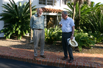 Photo of Dr. Barry Tomlinson talking with Dr. Christopher Quinn